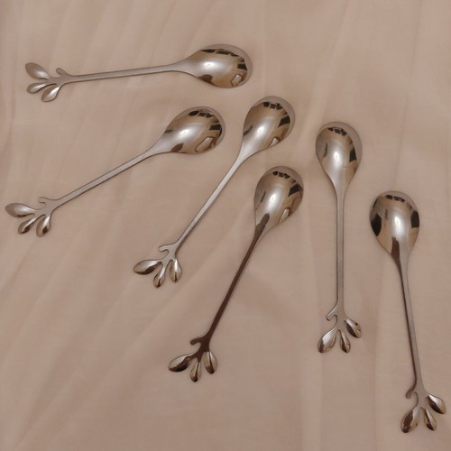 Set of 6 stainless steel spoons with leaf design like new