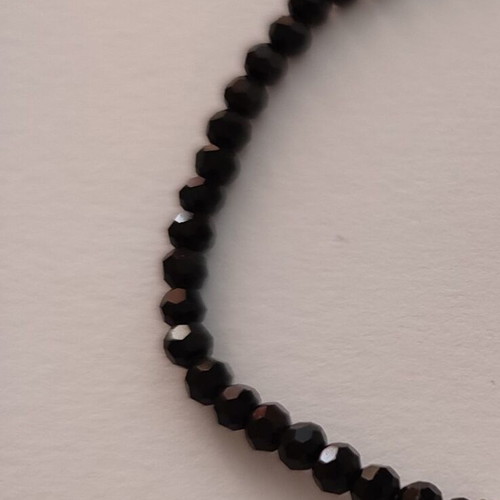 Bracelet 17cm with small cross and black beads like new