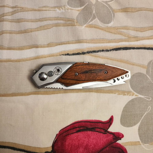 Decorative steel knife like new with button and safety lock