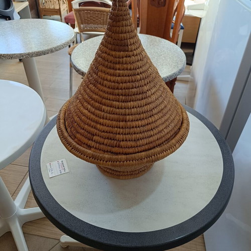 Handmade woven basket with conical lid used, natural fibers