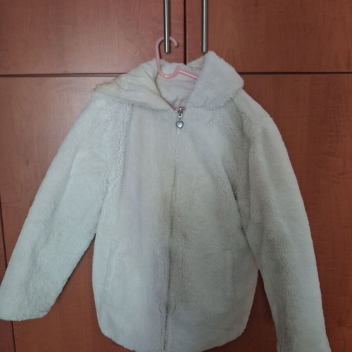 Reversible fur jacket with hood and pockets