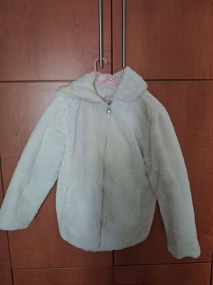 Reversible fur jacket with hood and pockets