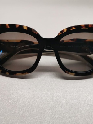 Prada sunglasses used, black and brown lenses with wear