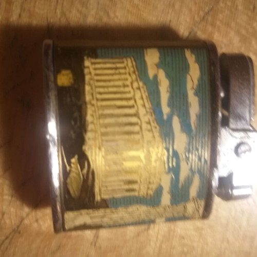 Penguin petrol lighter used, collectible