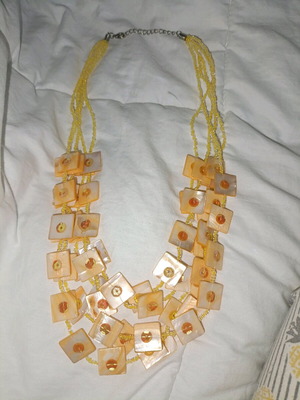 Necklace used with yellow beads and square elements