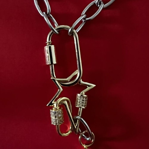 Long pendant with silver chain and gold rings, star and diamond-shaped drop