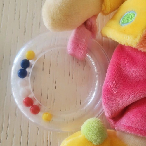 Nicotoy plush doll with rattle and belly horn for babies like new
