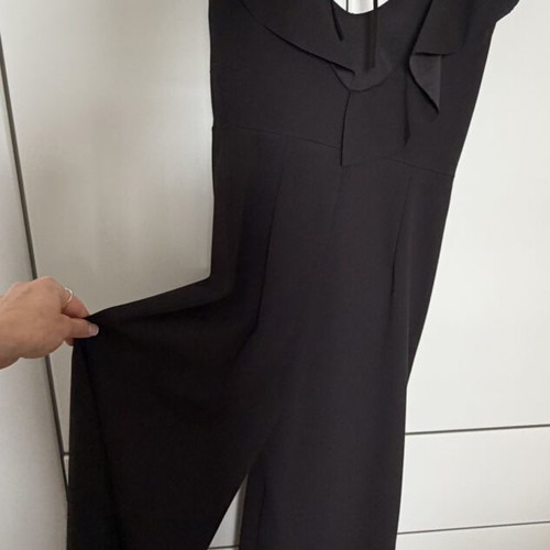Jumpsuit with ruffles one size like new, black