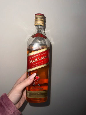 Johnnie Walker Red Label whiskey used, opened, still full