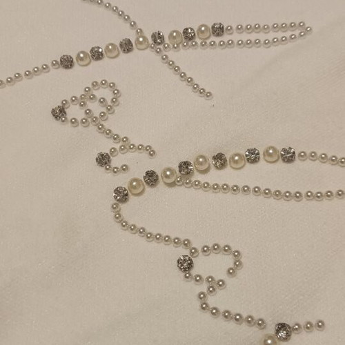 White sweater with rhinestones and pearls