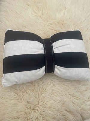 Decorative pillow used, approximately 30 cm