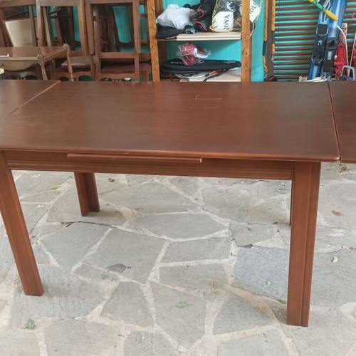 Wooden dining table used with extension