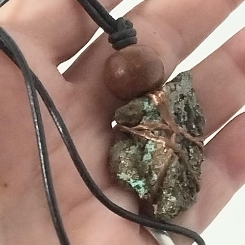 Pendant with pyrite new, gold copper wire and leather