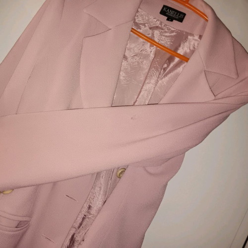 Kanellis Collection soft pink jacket used with wear