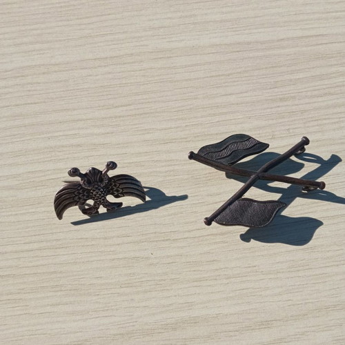 Silver pins used with eagle and crossed flags
