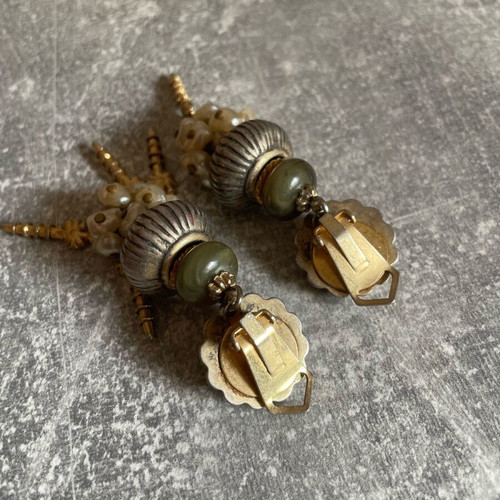 Gold dangling earrings used, missing some dangles