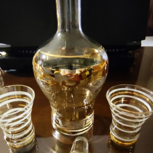 Vintage glass decanter set with 2 glasses used, gold decorations