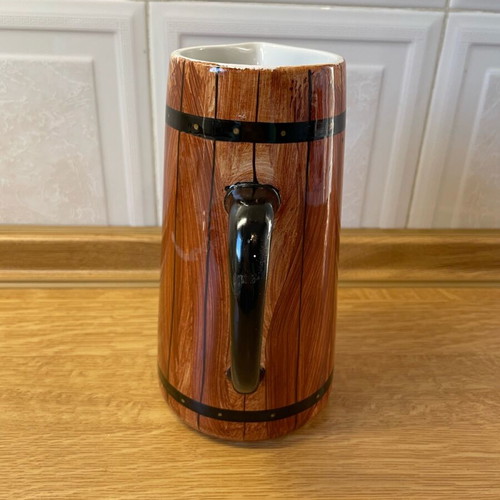 Vintage ceramic pitcher like new with wooden barrel design