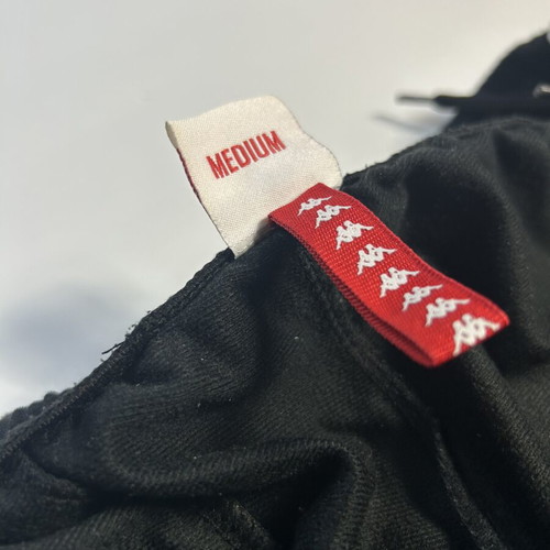 Kappa 222 Banda Astoria track pants men's black white tape loose fit