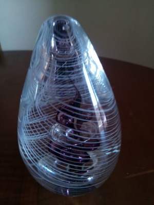 Glass decorative egg used with purple-white flower inside