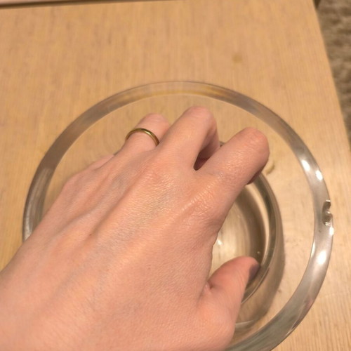 Glass decorative bowl used with silver flower design