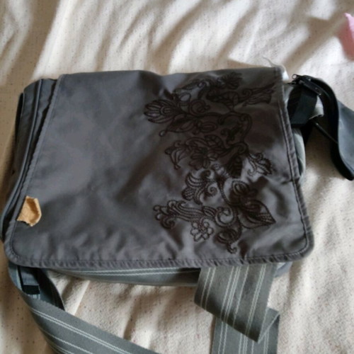 Lassig changing bag used, messenger with strap and spacious compartments