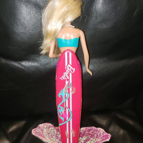 Barbie Merliah doll used with surfboard and mermaid tail