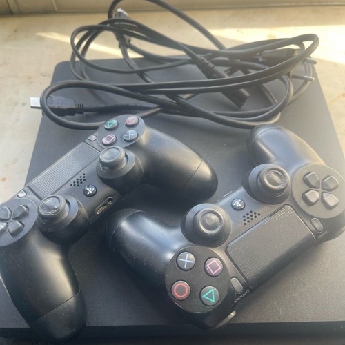 PlayStation 4 (PS4) like new with 2 controllers