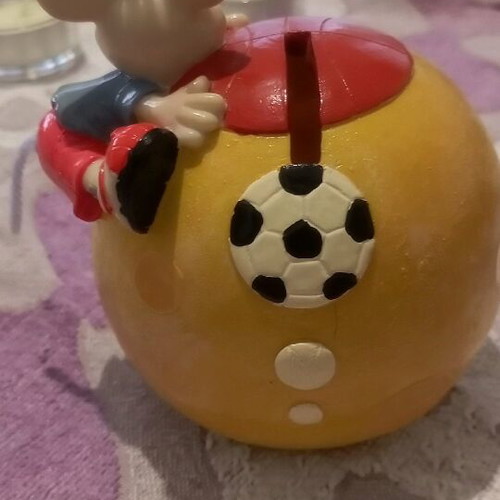 Ceramic piggy bank used with bottom opening