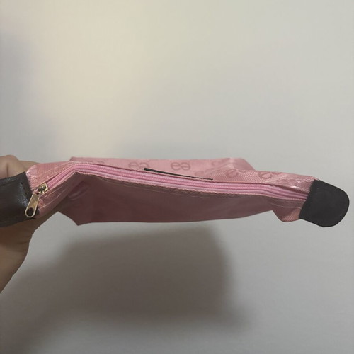 Pink toiletry bag like new with all-over logo pattern