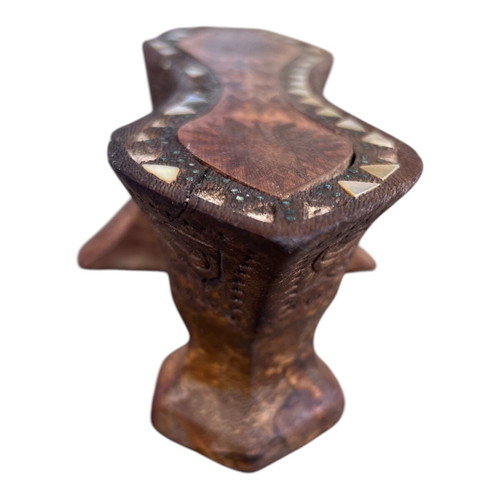 Wooden handmade ethnic decoration with mother of pearl used