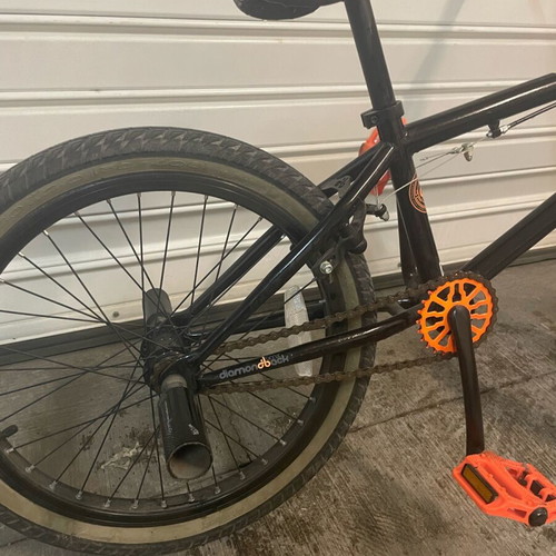 BMX bicycle like new, black, with extra metal pegs for tricks