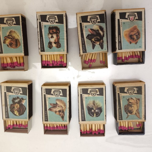 Collectible matchboxes used, set of 8 with dog designs, full of matches