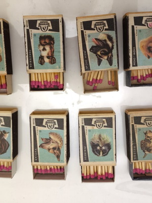 Collectible matchboxes used, set of 8 with dog designs, full of matches