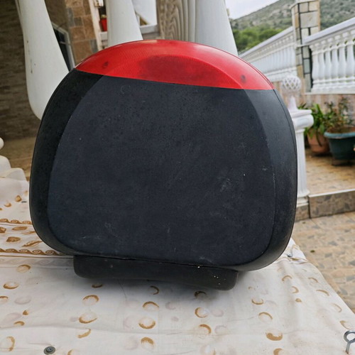 Large motorcycle top case used with key and passenger cushion