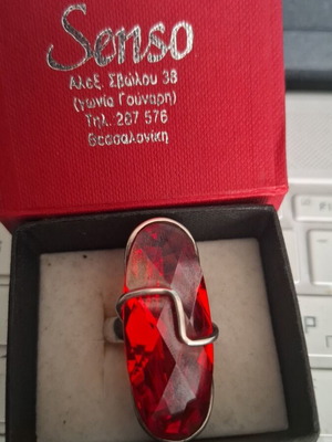 Silver ring 9.25 with red stone like new, adjustable size