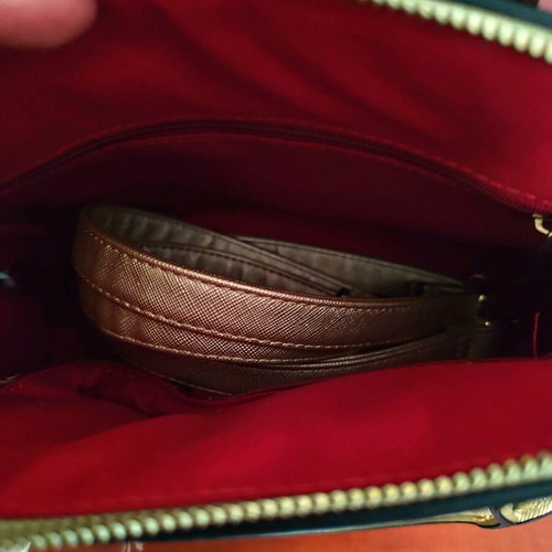 Gold handbag like new with detachable strap