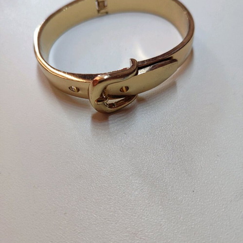 Handcuff bracelet in yellow color like new