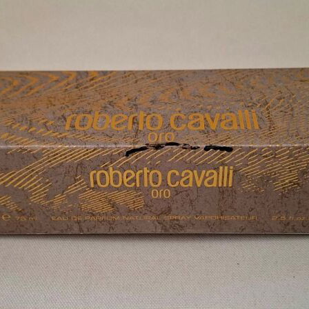 Roberto Cavalli Oro and Christian Dior J'adore empty perfume bottles