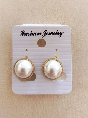 Clip-on earrings with white pearls, new