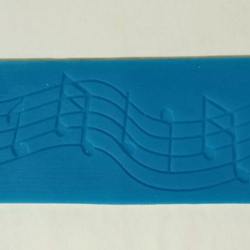 Silicone mold with musical theme pentagram, notes and treble clef like new