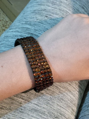 Bracelet with rhinestones used, dark orange-brown color