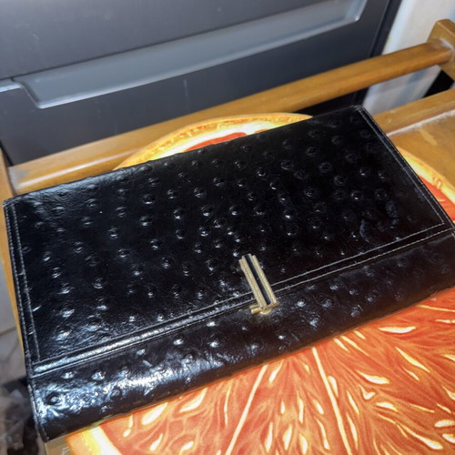 Black clutch bag like new with embossed texture