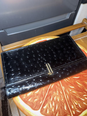 Black clutch bag like new with embossed texture