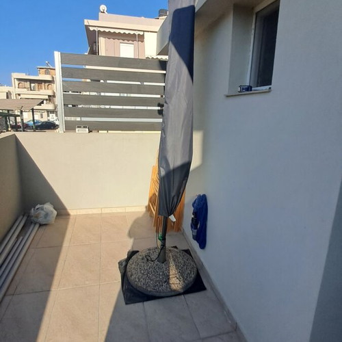 Balcony umbrella used with cover and base