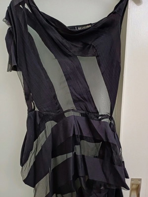 Religion dress used with asymmetrical sleeve and black stripes