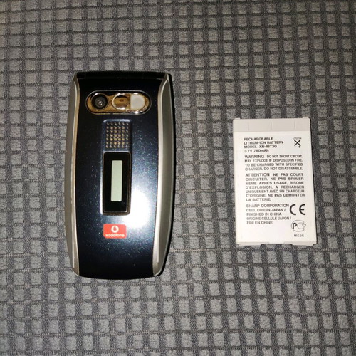 Sharp GX25 used black mobile phone with wear marks