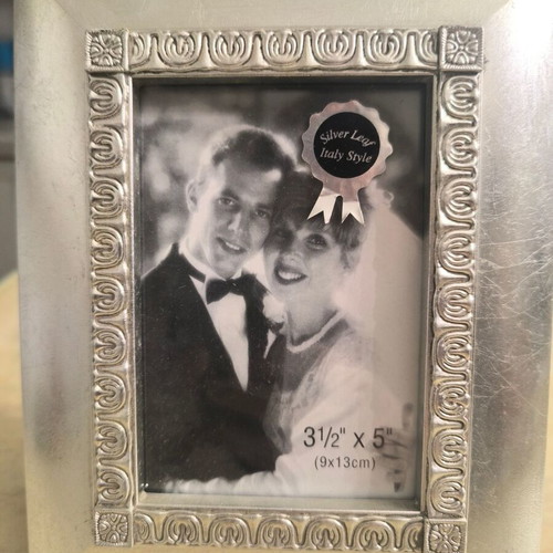 Silver photo frame like new with elegant decorative border