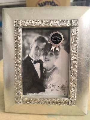 Silver photo frame like new with elegant decorative border