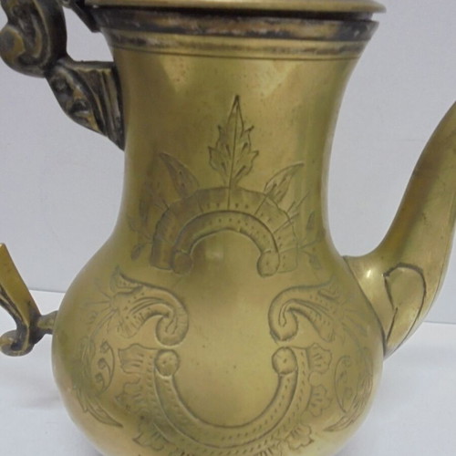 Old bronze teapot with decorative ornaments